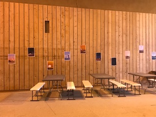 The inside wall of a gymnasium, again decorated by lots of Star-Wars–themed posters in a wavy pattern.